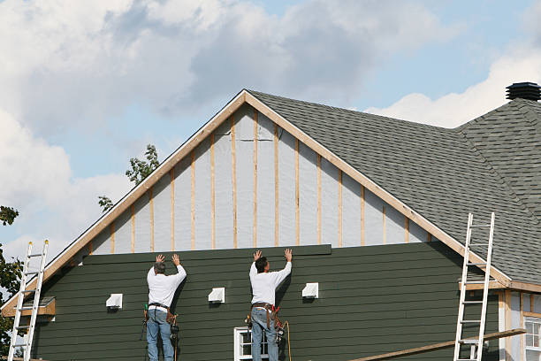 Professional Storm Damage Siding Repair technician working in Newbury, OH